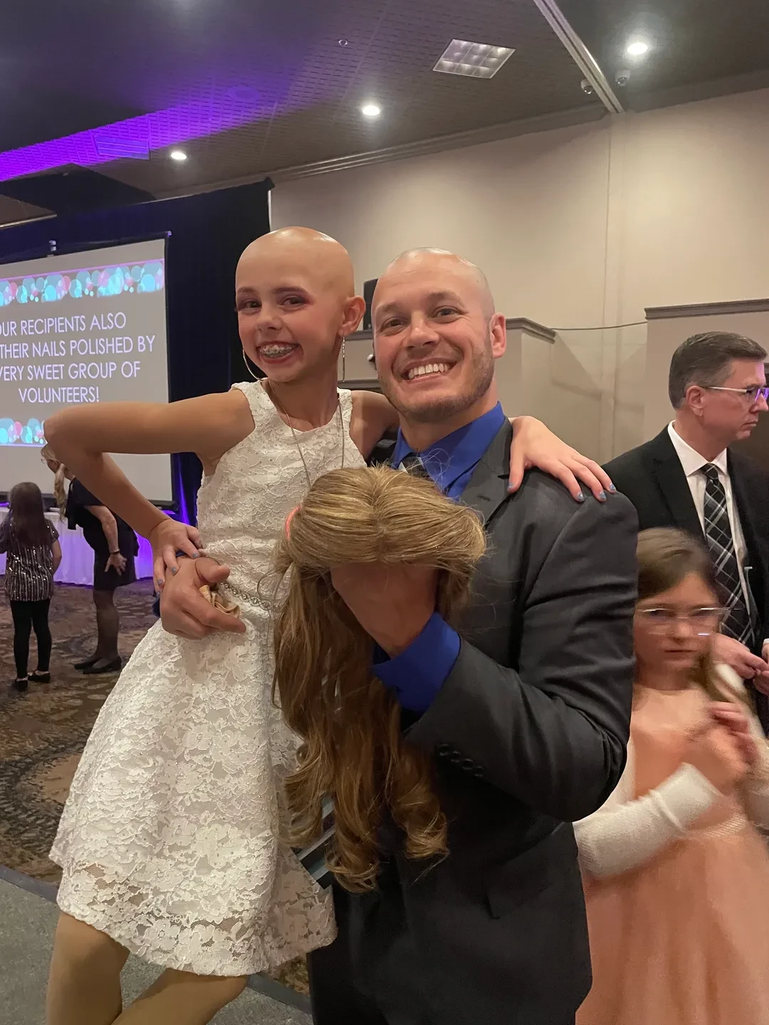 Child celebrating at the Children with Hair Loss Charity Ball