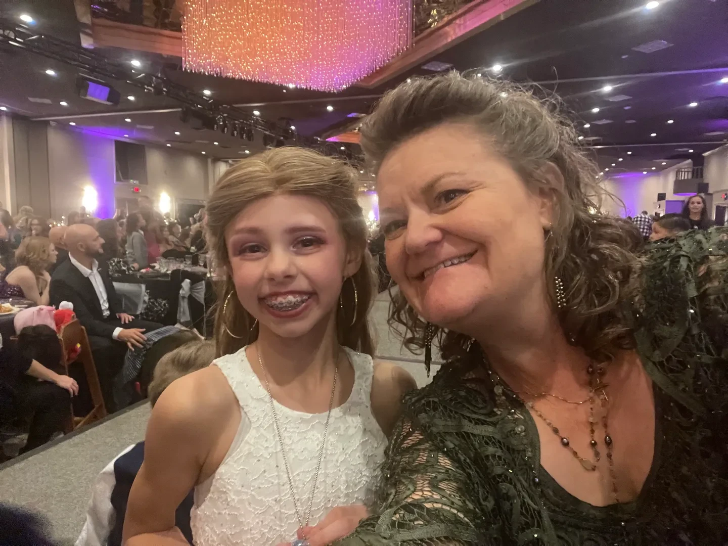 Smiling child and adult at the Children with Hair Loss gala