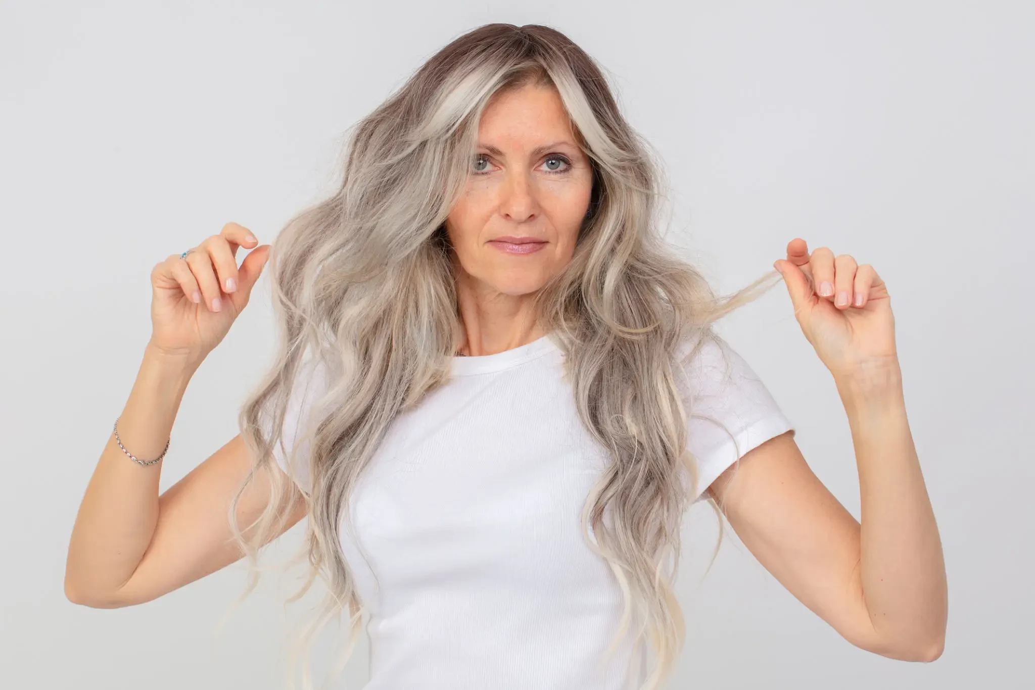 Woman with natural-looking hair topper showing volume and coverage