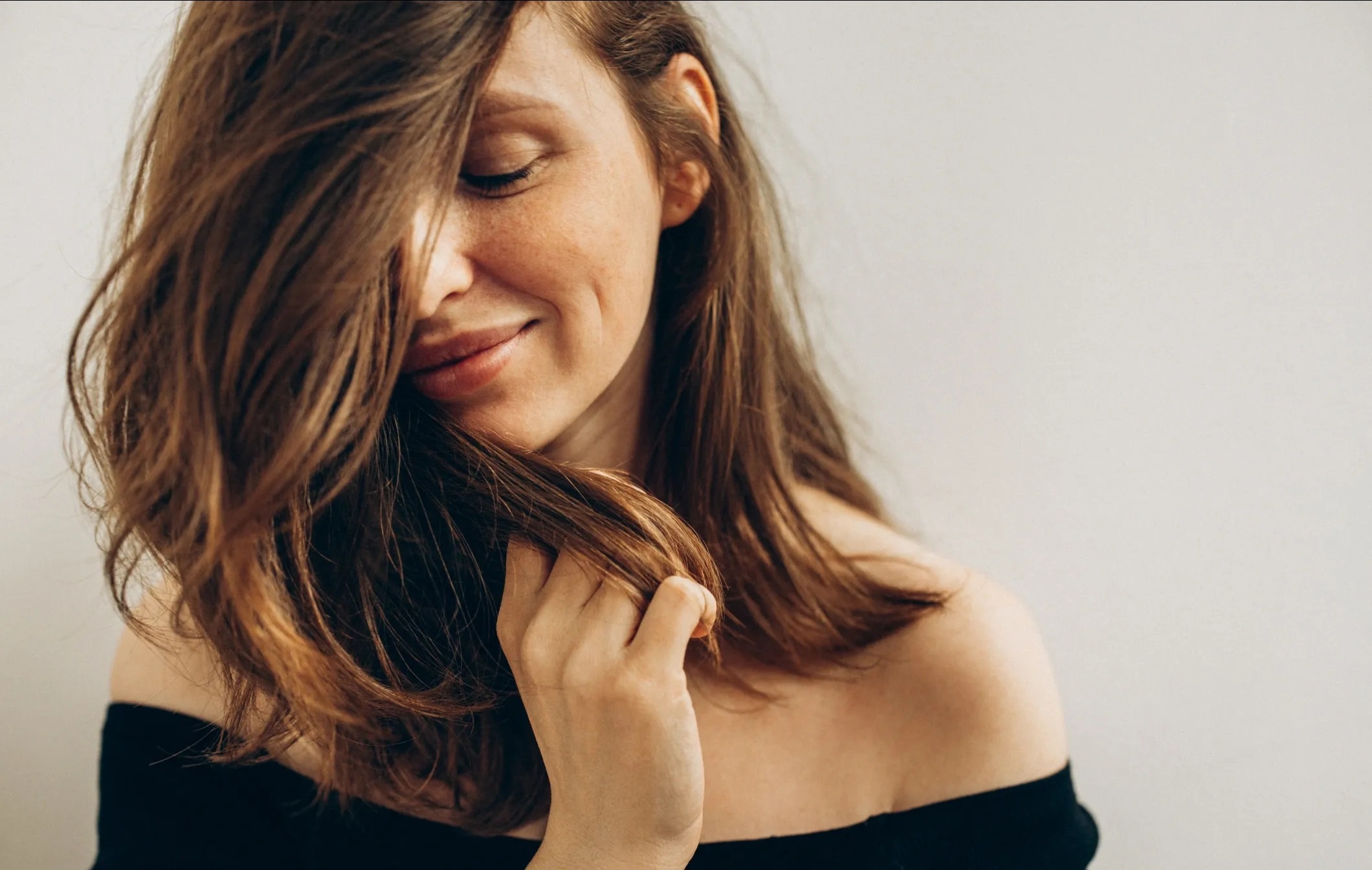 Woman with natural-looking hair volume in a salon